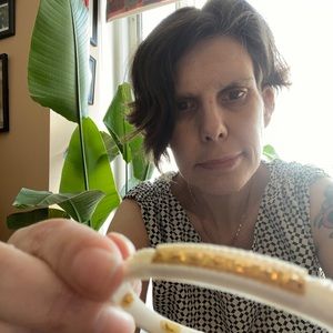 Hand Carved bone bracelet inlaid with 22 kt gold